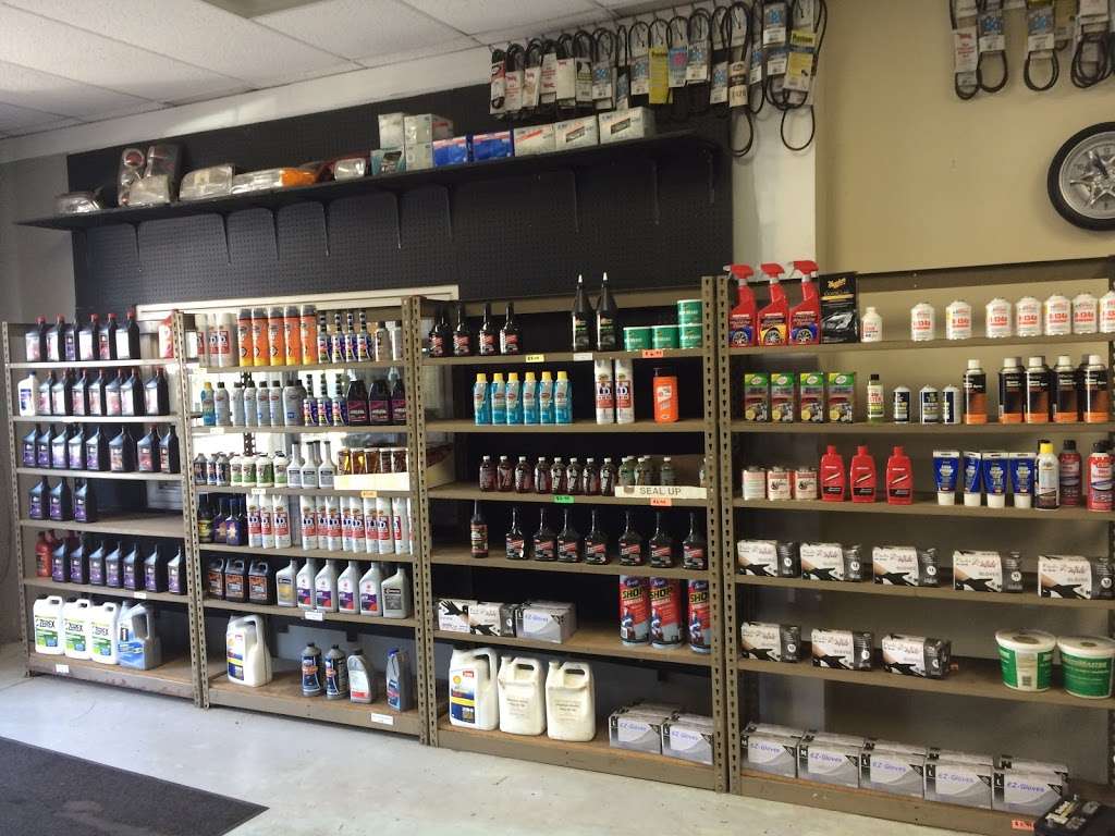 Shelves of maintenance fluids and parts inside ACR Auto Parts